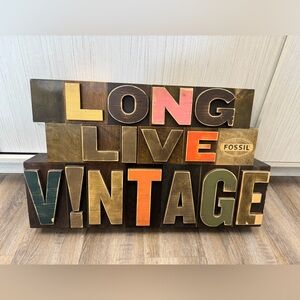 Fossil ‘Long Live Vintage’ store fixture display prop.Measures 28”lx16.5”wx4.5”d